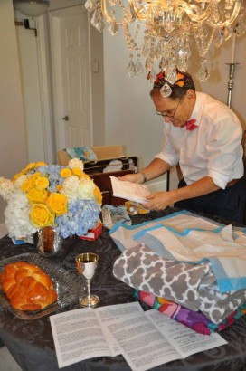 Bris ceremony decorations and Dr Krinsky holding a book