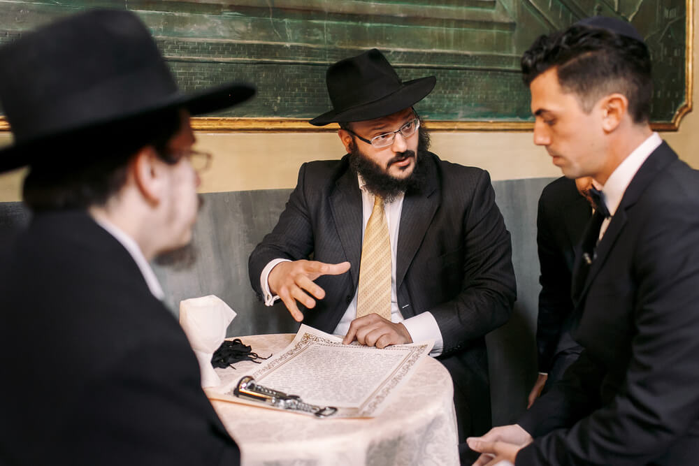 Jews Talk About Something While Sitting at the Table