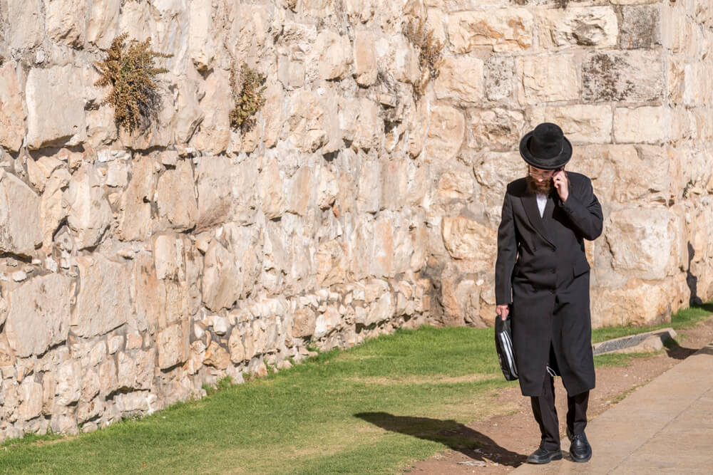 An Ultra Orthodox Jewish or Haridi Man in Traditional Religious Outfit Walking in the Old City of Jerusalem