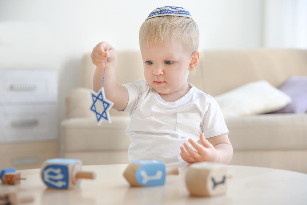 Little Jewish Boy With Star of David at Home