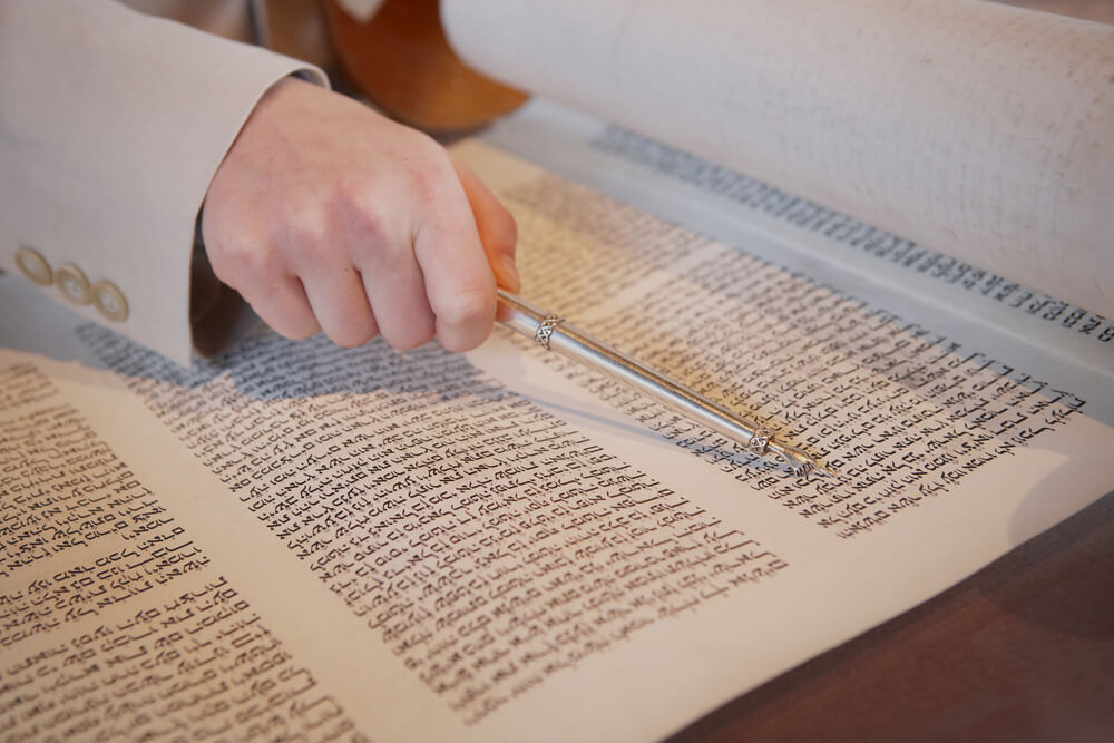 Hand of Boy Reading the Jewish Torah